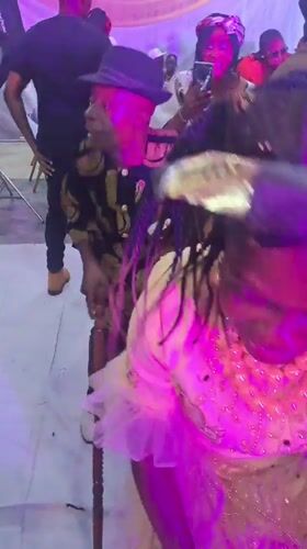 Indoor celebration with traditional dancing in Dutsen Alhaji, Nigeria