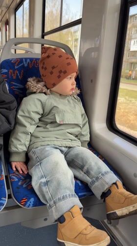 Child rides public transport in Yaroslavl wearing winter clothing