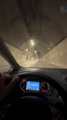Driver travels through tunnel near Đurmani, Montenegro