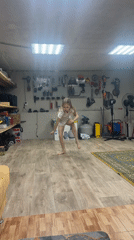 Children play indoors, person bonds with dog in rural Russia