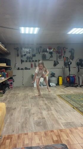 Children play indoors, person bonds with dog in rural Russia