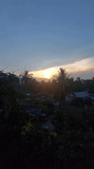 Sunrise captured over tropical landscape in Baan Mae Nam, Thailand