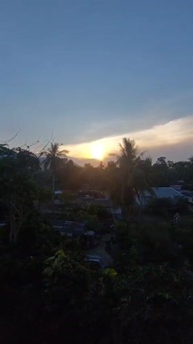 Sunrise captured over tropical landscape in Baan Mae Nam, Thailand