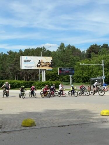 Children's cycling event documented in Perm, Russia morning scenes