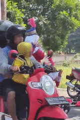 Marching bands and costumed parade performers fill Ngasem streets