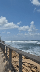 Coastal scene captured from Tel Aviv boardwalk on bright day