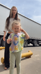 Family playtime amid warehouse operations in Sluchainyi, Russia