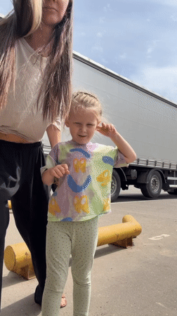 Family playtime amid warehouse operations in Sluchainyi, Russia