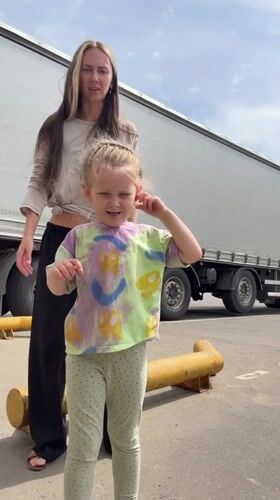 Family playtime amid warehouse operations in Sluchainyi, Russia