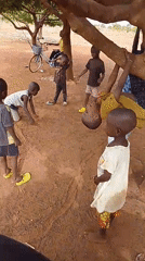 Children play under trees in Dungu, Ghana