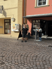 Baby takes morning walk on cobblestones in Meisenheim
