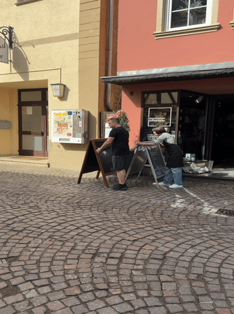 Baby takes morning walk on cobblestones in Meisenheim