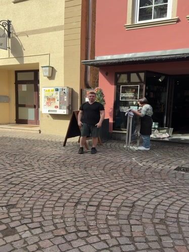 Baby takes morning walk on cobblestones in Meisenheim