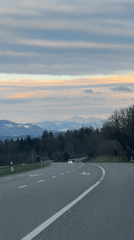 Car travels winding road in Maur, Switzerland