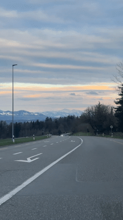 Car travels winding road in Maur, Switzerland