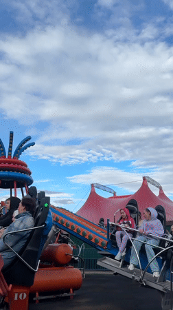 Carnival riders enjoy spinning attraction in Sirius, Russia