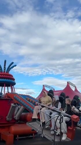 Carnival riders enjoy spinning attraction in Sirius, Russia