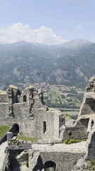 Visitor captures scenic mountain views from historic Italian castle