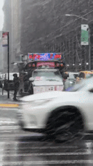 Heavy snowstorm blankets New York City during Friday evening rush