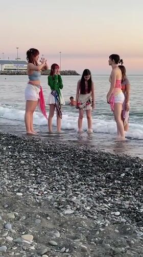 Golden hour on Sochi's Black Sea beach, summer evening.