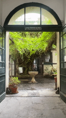 Berlin courtyard with fountain captured through Fachwerkhof archway