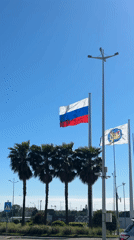 Flags fly under clear skies in Sirius, Russia