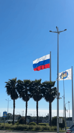 Flags fly under clear skies in Sirius, Russia