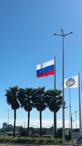 Flags fly under clear skies in Sirius, Russia