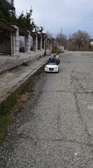 Children playing with bikes, scooters, toys in Bulgarian towns