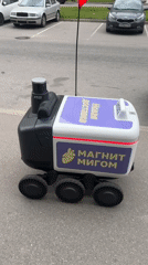 Russian delivery robot and Honda motorcycle spotted in urban area