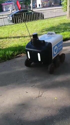 Delivery robot rolling through Nizhny Novgorod streets and courtyards