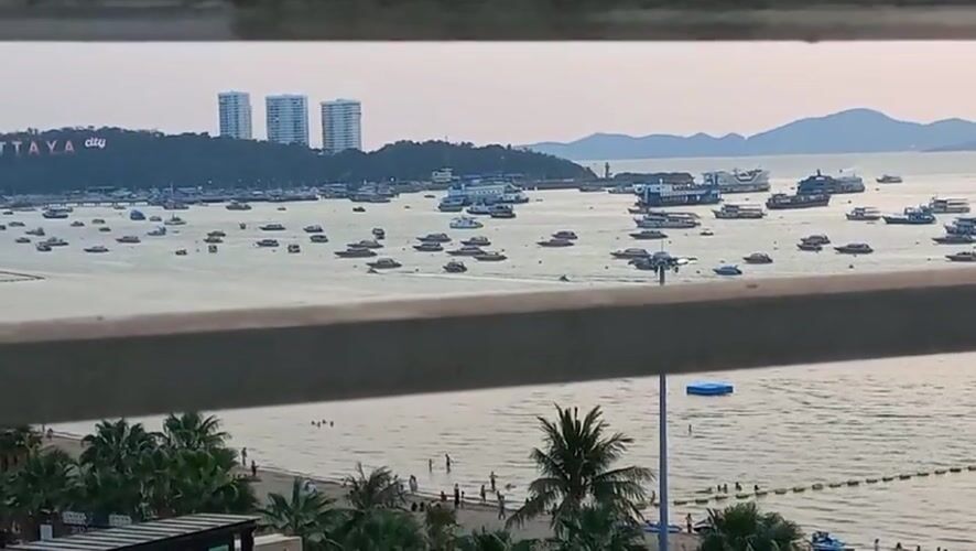 Elevated views capture busy Pattaya Bay and beach scene