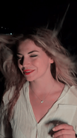 Woman poses for nighttime photo session in Budva