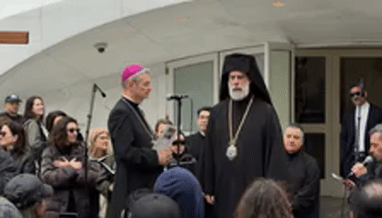 Interfaith religious procession with cross-carrying crowds draws hundreds in NYC