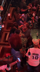 Nightclub patrons dance, socialize during evening entertainment event