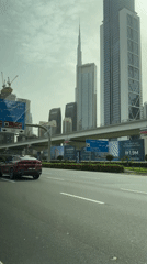 Red BMW X6 spotted on Dubai Business Bay roadway