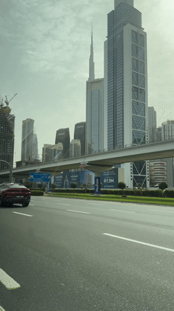 Red BMW X6 spotted on Dubai Business Bay roadway