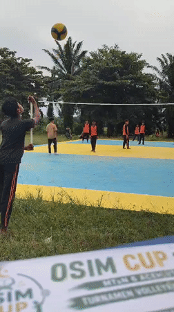 Young athletes play volleyball on outdoor court in Blangriek