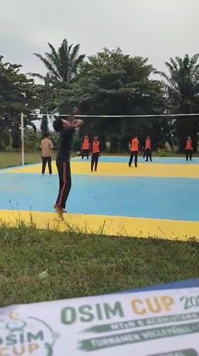Young athletes play volleyball on outdoor court in Blangriek