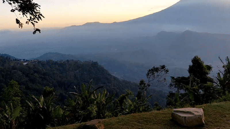 Volcanic sunrise over Abang, Bali, mist and golden light