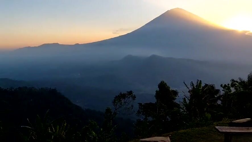 Volcanic sunrise over Abang, Bali, mist and golden light
