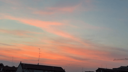 Colorful sunset observed over suburban area April 27