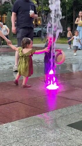 Kids cool off in a glowing fountain in central Yerevan
