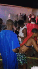 Nighttime outdoor party documented in Awka, Nigeria