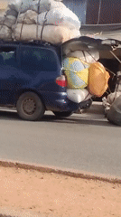 Morning street vendors and commercial activity documented in African town