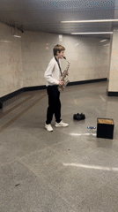 Saxophone performance filling a subway station with live music
