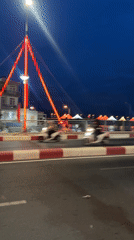 Evening temple visits and bridge crossings documented in Nha Trang