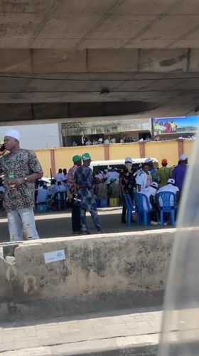 Community gathering under Lagos overpass draws crowd with chairs