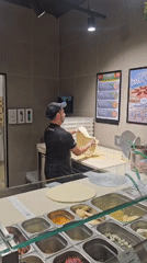 Pizza prep behind the counter in Stara Zagora