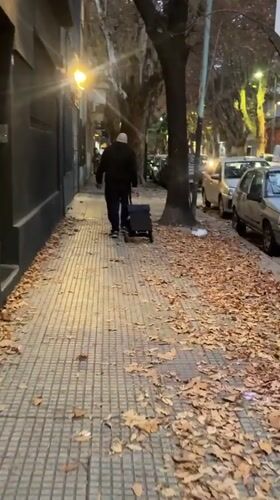 Man with cart, illness message captured in Buenos Aires